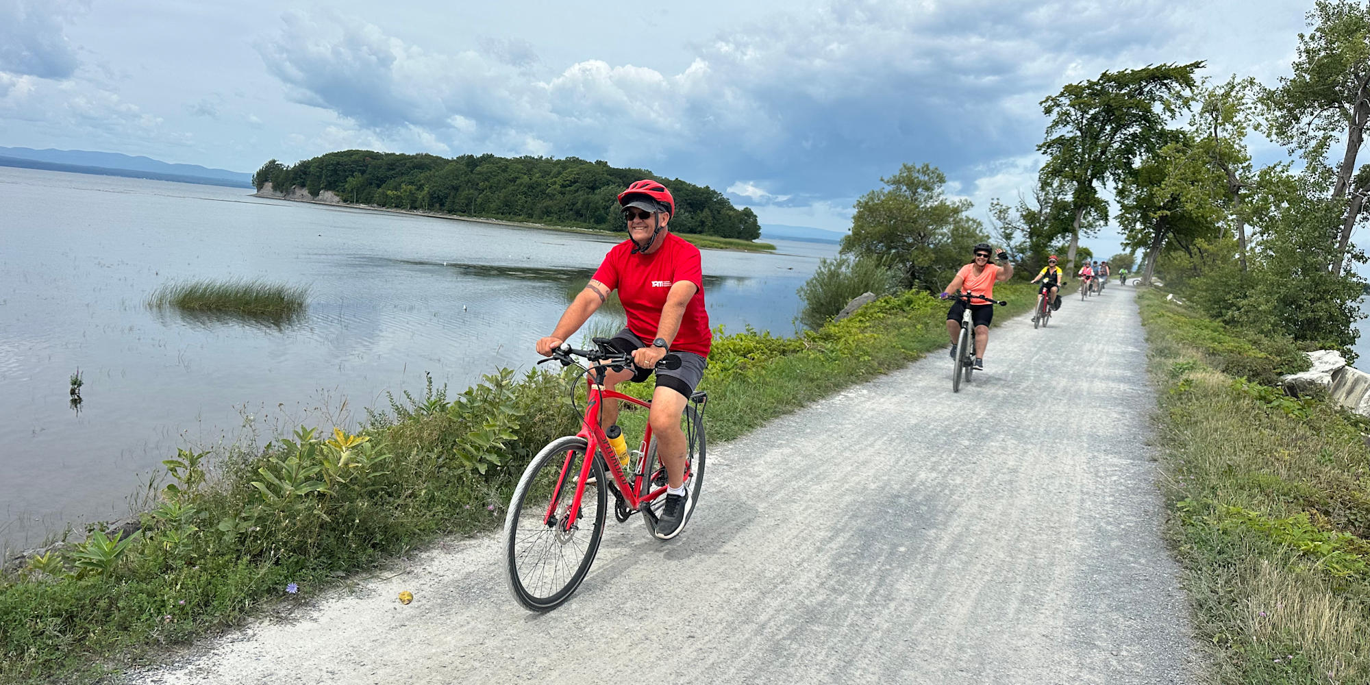 Guests cycling over Lake Champlain Causeway